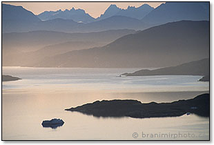 Misty sunrise in a fjord near Julianehaab