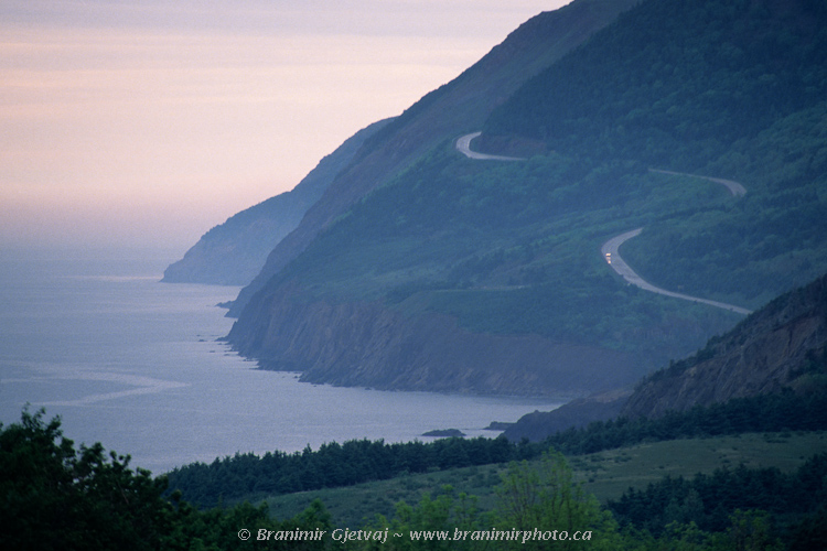 Car on Cabot Trail at sunset, Cape Breton Highlands National Park, Nova Scotia