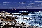  Large boats near rocky shoreline, after storm, Duncans Cove, Nova Scotia