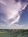 Prairie landscape with clouds at sunset, Grasslands National Park, Saskatchewan