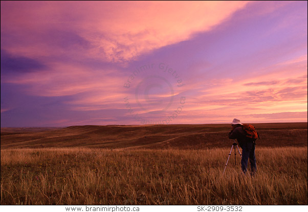 Photographer at sunrise, Grasslands National Park, Saskatchewan