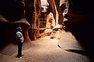 Person standing inside underground canyon, Antelope Canyon, Arizona