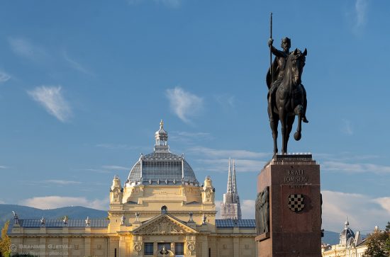 View of the statue of Croatian King Tomislav, Art Pavilion and Zagreb Cathedral. In Zagreb, Croatia