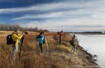 Photographers on the shore of South Saskatchewan River, Cranberry Flats